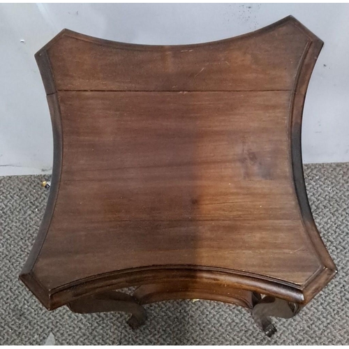 11 - Mahogany plantstand in Edwardian style with intricately carved legs and a curved top. It has a lower... 