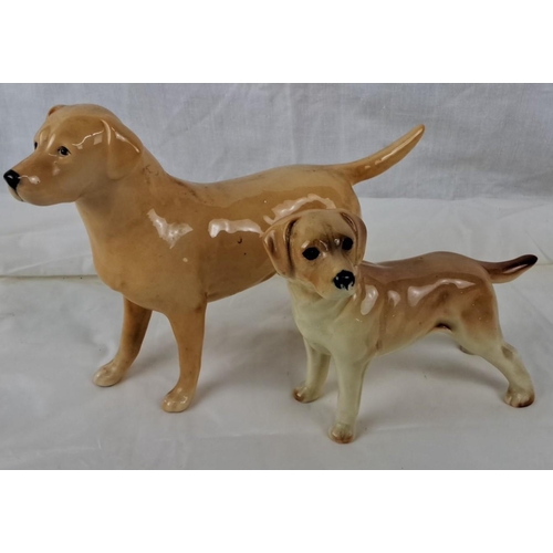 68 - Two ceramic dog figurines. One is marked 