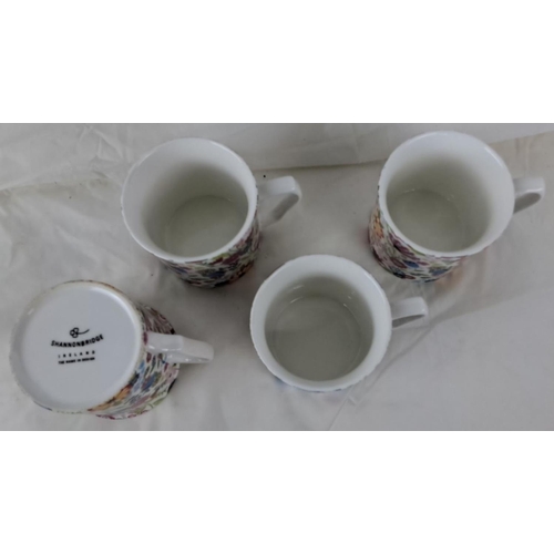 84 - This is a set of four ceramic mugs from Shannonbridge Ireland with a floral pattern.