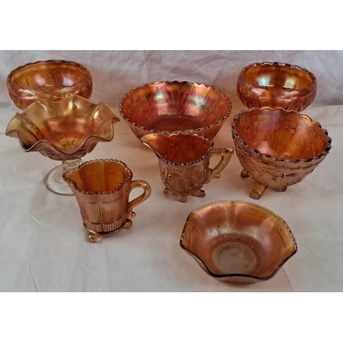 87 - A collection of vintage Marigold carnival glass dishes comprising bowls, compotes, and creamers.