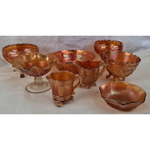 87 - A collection of vintage Marigold carnival glass dishes comprising bowls, compotes, and creamers.