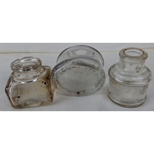 93 - Three vintage glass inkwells are included in the set, with a variety of shapes. One inkwell bears th... 