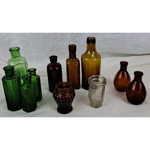 97 - Collection of antique glass bottles with embossed text. Comes in green, brown, and clear glass varie... 