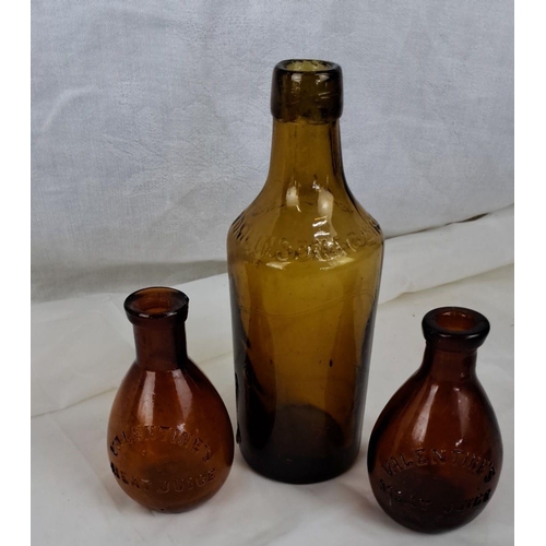 97 - Collection of antique glass bottles with embossed text. Comes in green, brown, and clear glass varie... 