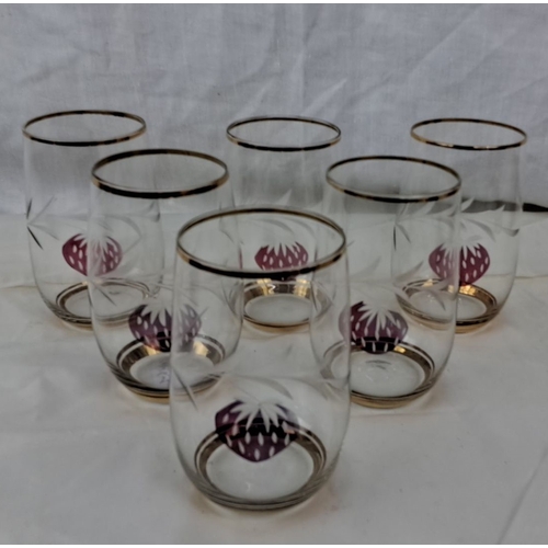 104 - The set includes six clear glasses. Each glass features an etched strawberry design and gold trim.