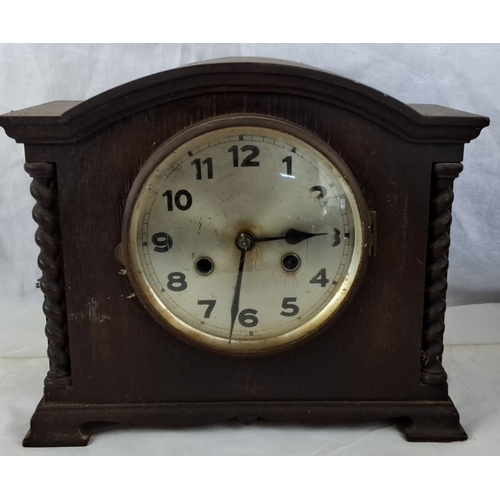 112 - Antique mantel clock with twisted column accents, wooden case, and key-wind mechanism. Period: 20th ... 