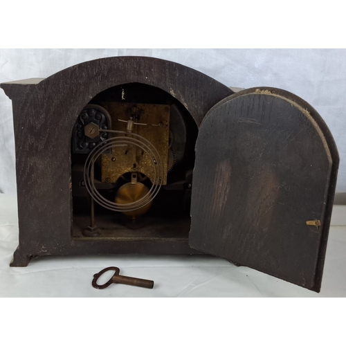 112 - Antique mantel clock with twisted column accents, wooden case, and key-wind mechanism. Period: 20th ... 