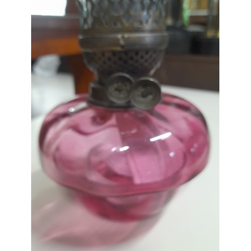 78 - A stunning antique ruby glass oil lamp with glass chimney.