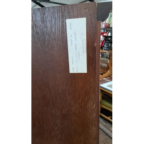 637 - This is a mahogany corner cabinet with brass hinges and a glass door. The cabinet is labeled 