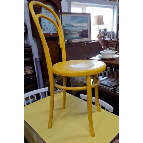 669 - Vintage yellow bentwood chair from the Mid-Century Modern period. Features a curved backrest and per... 