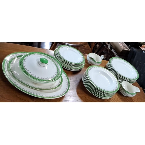 670 - A large vintage Alfred Meekin dinner set from England, showcasing green and gold floral design. The ... 