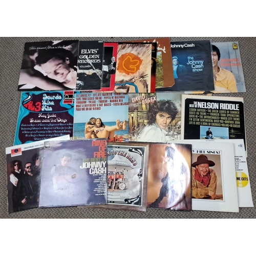 672 - Mixed lot of vinyl records featuring various artists such as Johnny Cash, Elvis Presley, Stevie Winw... 