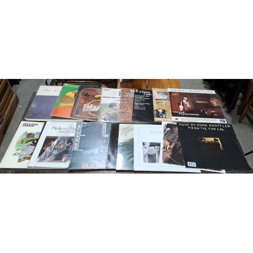 673 - This is a collection of 20 vinyl records. It includes albums from Elvis, Johnny Cash, Ike & Tina Tur... 