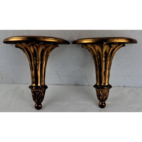 674 - Pair of gold gilt wall-mounted shelves in ornate design, 26cm x 21cm x 11cm.