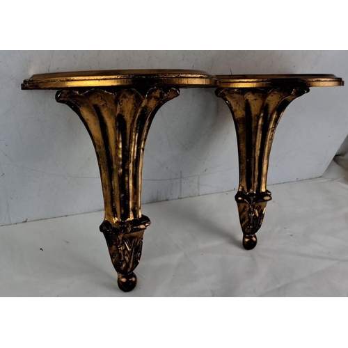 674 - Pair of gold gilt wall-mounted shelves in ornate design, 26cm x 21cm x 11cm.