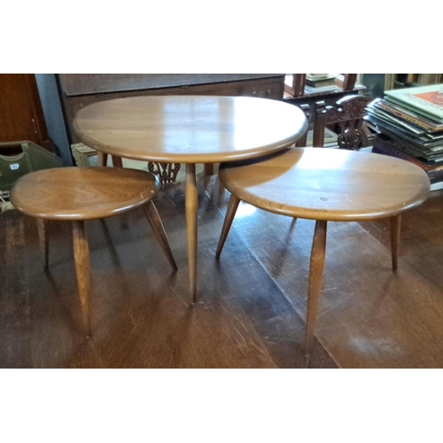 Set of three mid-century modern 'Pebble' nesting tables by Ercol, largest table 65cm x 44cm x 41cm.