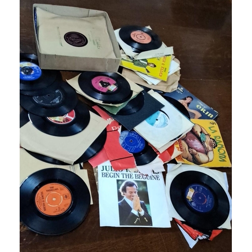 681 - This is a collection of vintage 45 RPM vinyl records. It features various artists and genres. Some o... 