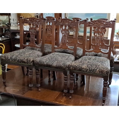 685 - Set of four Victorian carved oak dining chairs with upholstered seats. These chairs feature intricat... 