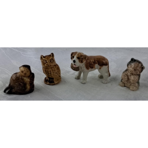 16 - Set of 9 Wade Whimsies featuring various animals including dogs, cats, an owl, and a decorative bowl... 