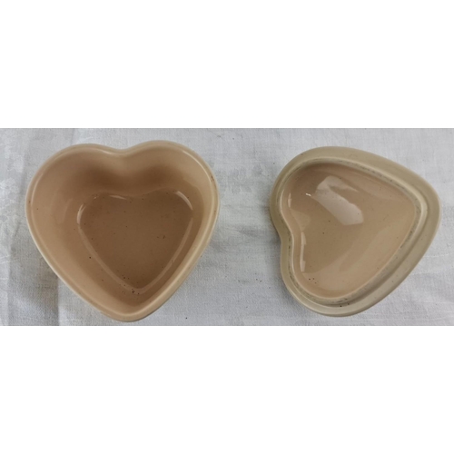 24 - Cream-colored Le Creuset heart-shaped stoneware dish with matching lid, marked 