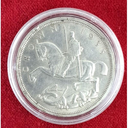 42 - 1935 Silver Jubilee Crown coin features George V on the obverse and St. George slaying the dragon on... 