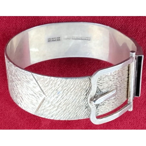 57 - Sterling Silver bracelet with textured band and buckle design.