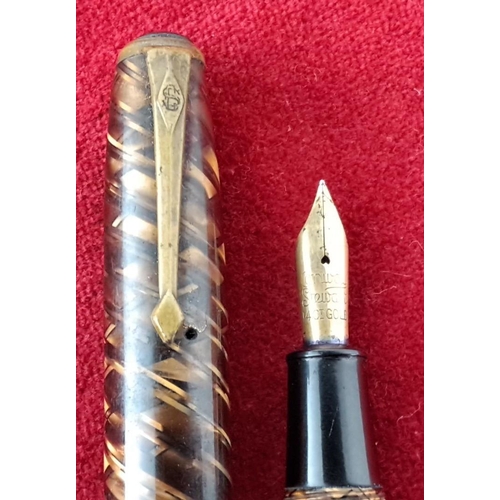 58 - 1930s Conway Stewart No. 28 Fountain Pen in marbled brown with amber and black accents, features a 1... 