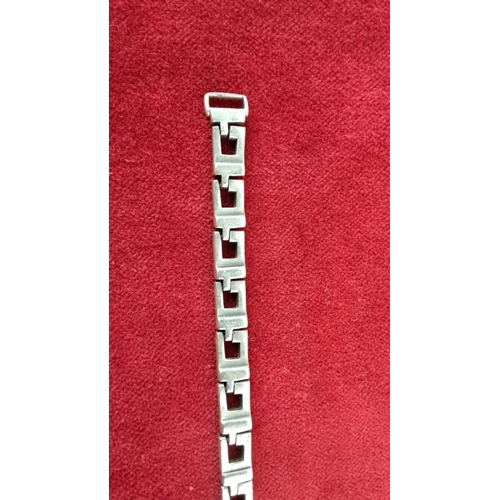 59 - Sterling silver bracelet with geometric link pattern by Gucci, marked 