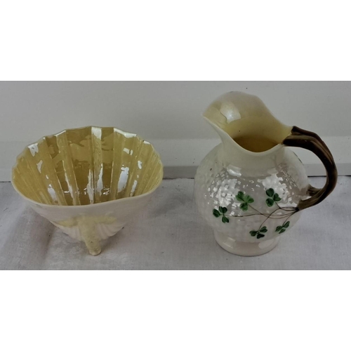 61 - Belleek porcelain jug with shamrock motif and a cream-colored scalloped bowl with gloss finish.