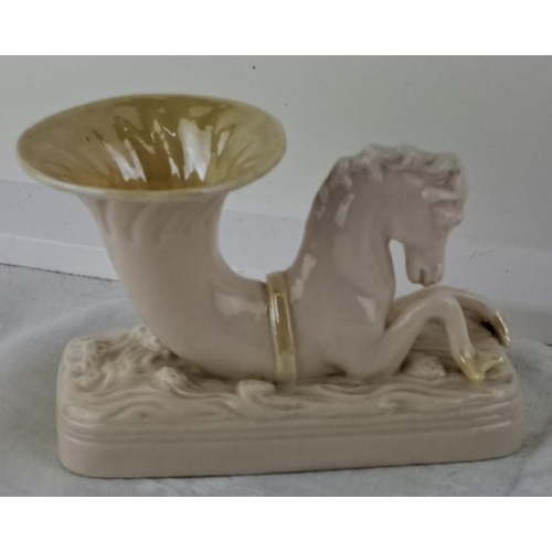 62 - Unusual Belleek vase featuring a seahorse design, white with gold accents, measures 8 inches in heig... 