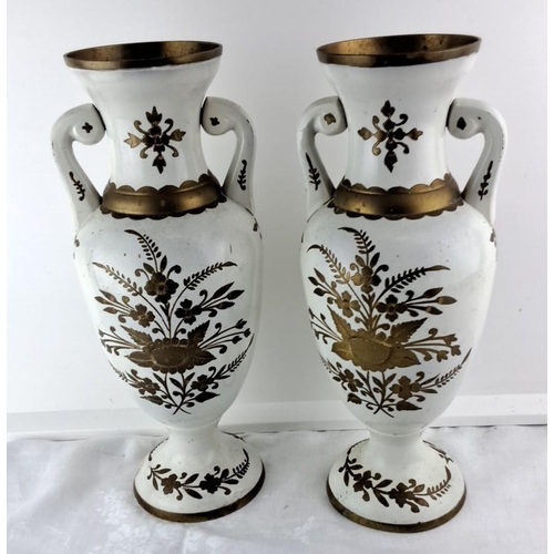 65 - Pair of vintage white enamel vases featuring gold floral motifs and dual handles with intricate gold... 