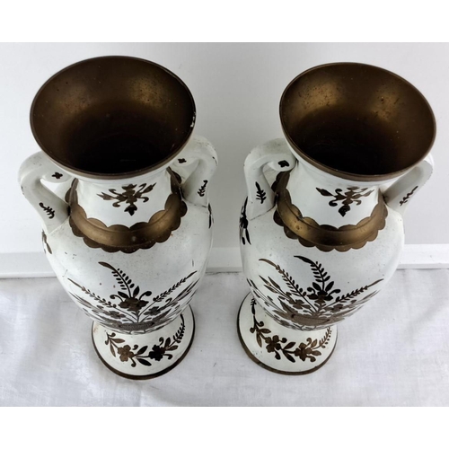 65 - Pair of vintage white enamel vases featuring gold floral motifs and dual handles with intricate gold... 