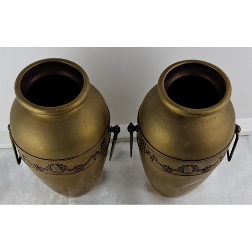 67 - Pair of antique brass vases with ornate floral wreath and garland design, featuring side handles.