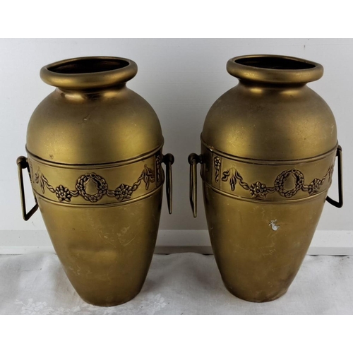 67 - Pair of antique brass vases with ornate floral wreath and garland design, featuring side handles.