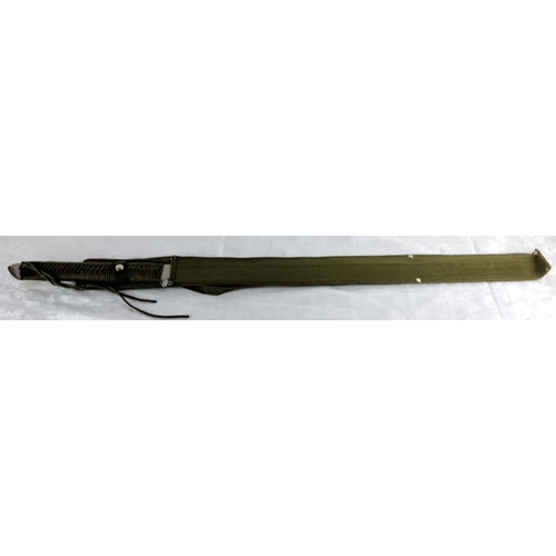 73 - Military-style sword with green woven fabric handle and scabbard, featuring decorative knotting on t... 