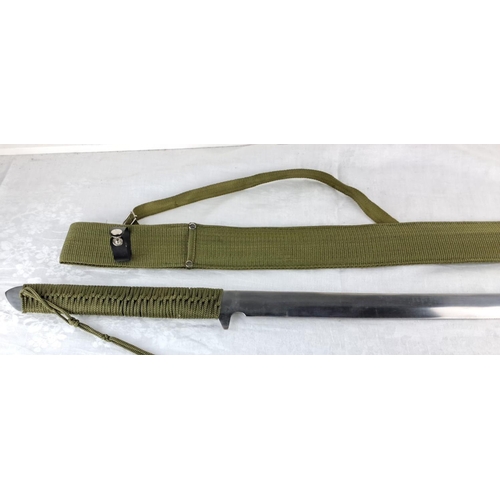 73 - Military-style sword with green woven fabric handle and scabbard, featuring decorative knotting on t... 