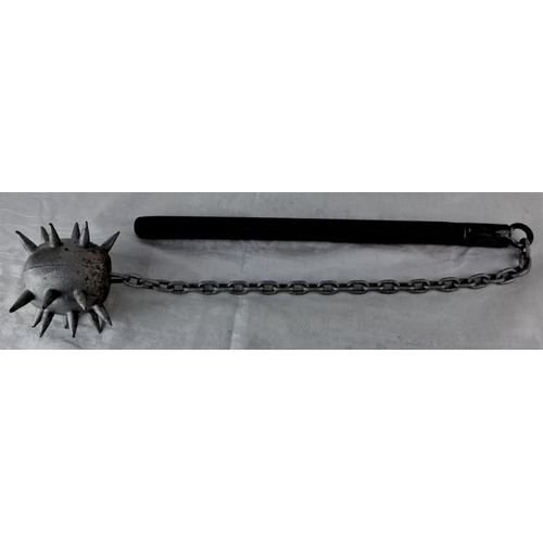 75 - Replica medieval flail with wooden handle, metal chain, and spiked ball.