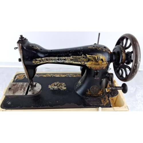 83 - Antique Singer hand-crank sewing machine with Egyptian motifs, from the early 20th century. Black ca... 