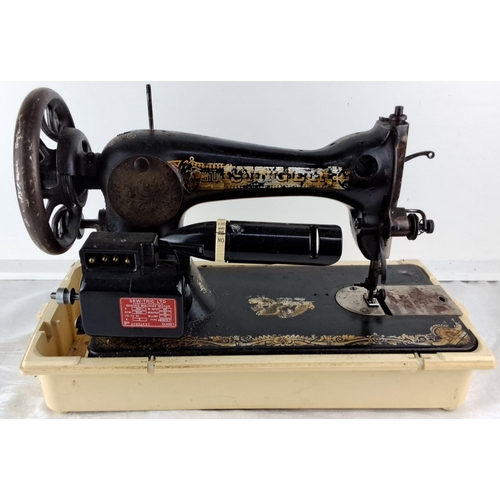 83 - Antique Singer hand-crank sewing machine with Egyptian motifs, from the early 20th century. Black ca... 