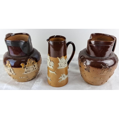 90 - Set of three stoneware relief-molded hunting jugs featuring dark brown glaze and detailed imagery of... 