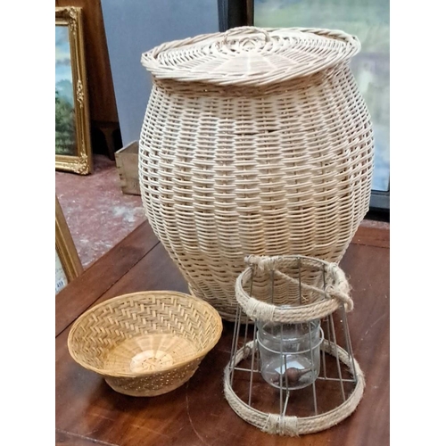 575 - Large lidded linen basket, woven bowl, and rustic wire-frame lantern with glass insert and jute acce... 