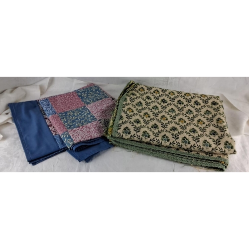 576 - Set of two fabric pieces: a blue and patchwork quilt, and a floral tapestry with green trim.