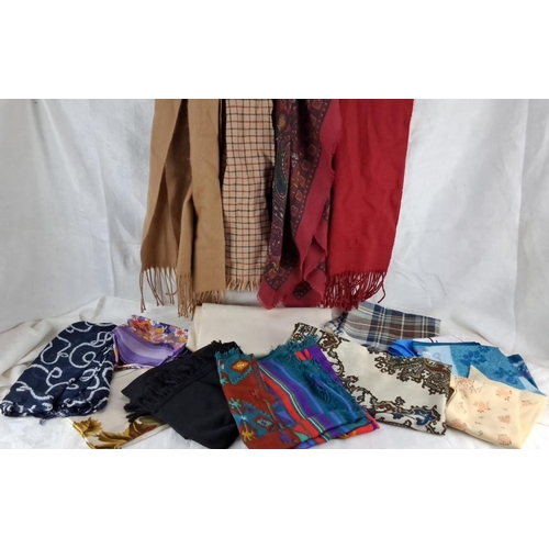 580 - Assorted scarves and shawls, various materials and patterns, including plaid, floral, paisley, and s... 