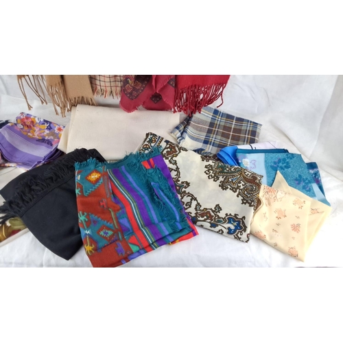 580 - Assorted scarves and shawls, various materials and patterns, including plaid, floral, paisley, and s... 