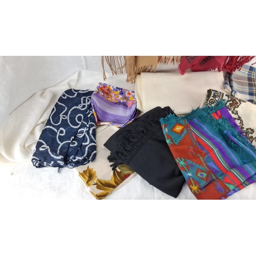 580 - Assorted scarves and shawls, various materials and patterns, including plaid, floral, paisley, and s... 