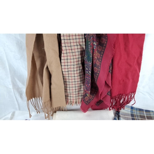 580 - Assorted scarves and shawls, various materials and patterns, including plaid, floral, paisley, and s... 