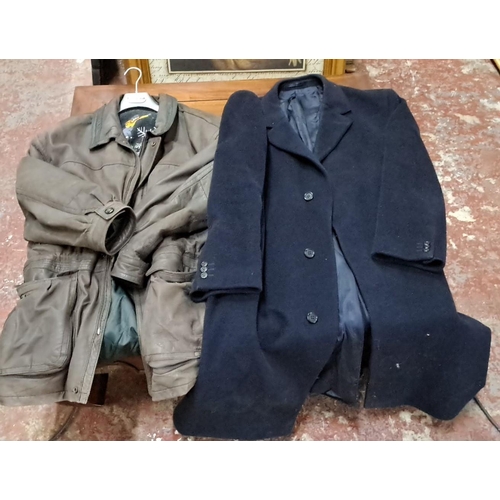 586 - Two vintage jackets: one black wool and cashmere blend overcoat with three-button closure and one br... 