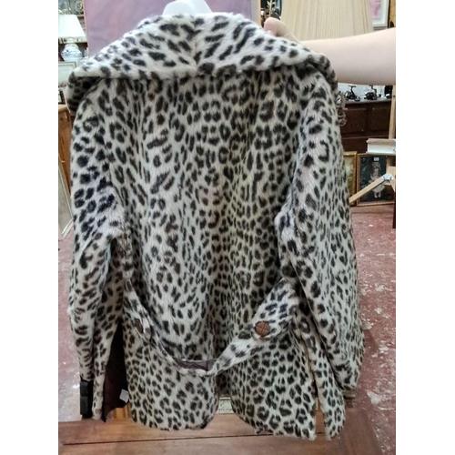 587 - Elmoor of London leopard print faux fur coat features a classic double-breasted design and notched l... 