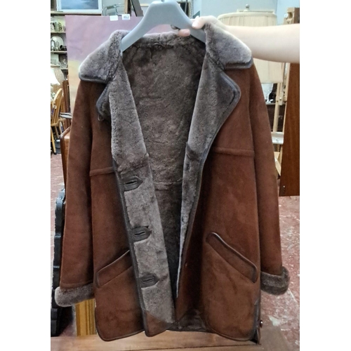 591 - Vintage Sheepskin coat with brown exterior and grey fluffs, featuring foldable cuffs, side pockets, ... 