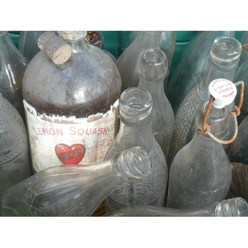 13 - A large collection of vintage glass bottles to include Duckworth & Co.